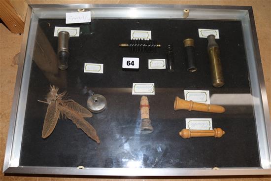 Framed collection of duck whistles
